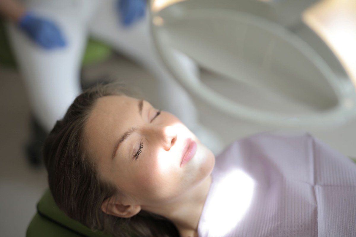 Calm, relaxed patient resting in the dental chair during sedation dentistry at The Port Dental Clinic in Calgary NE