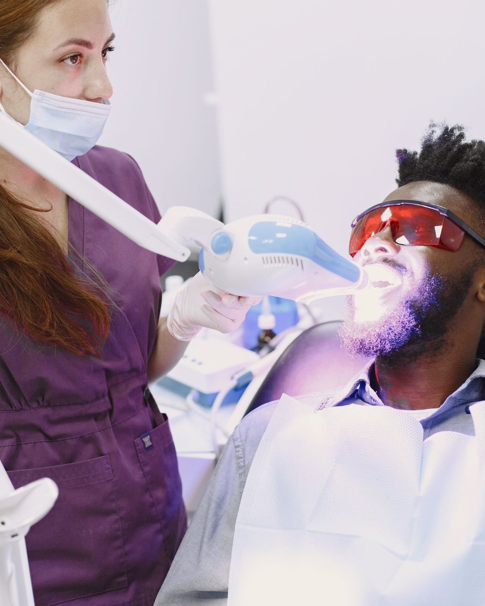 In-office Zoom teeth whitening with an LED whitening lamp at The Port Dental Clinic in Calgary NE